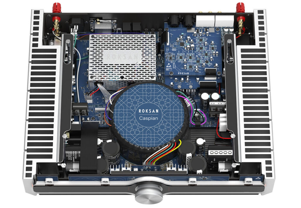 Internal layout of Roksan Caspian 4G amplifier showing toroidal transformer, dual mono amplifier stages, and high-capacity capacitors