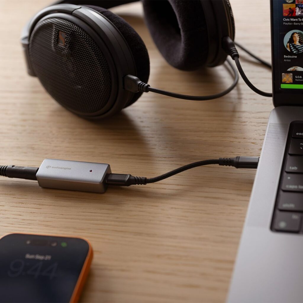 AudioEngine HXL portable DAC amp connected to laptop with headphones. 