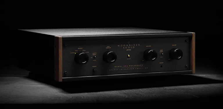 Moonriver 404 Reference Integrated Amplifier on a granite tabletop with black background